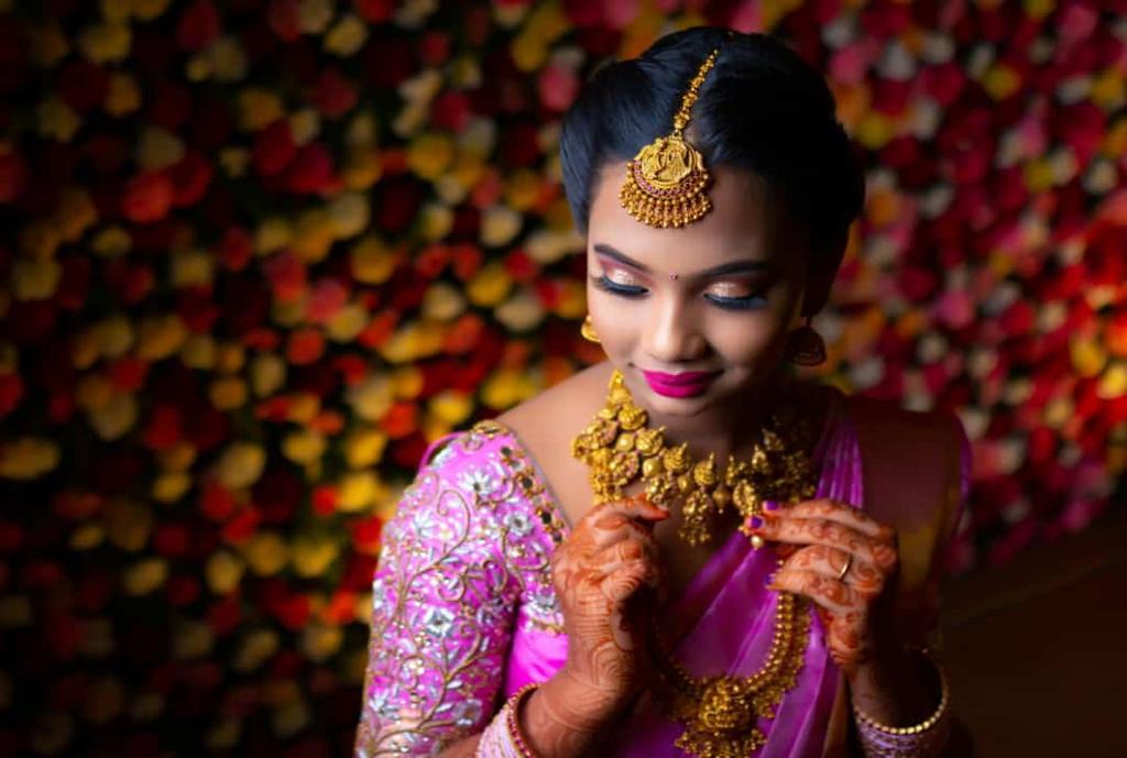 Bridal gold jewellery and HD makeup detail by Padma